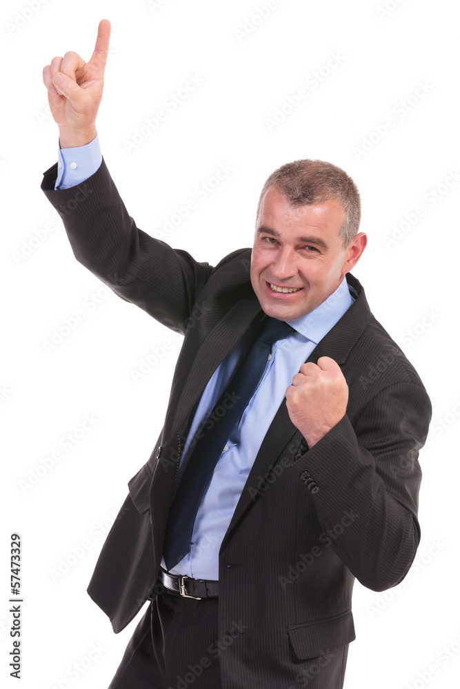 business man cheers while pointing upward business man cheers while pointing upward