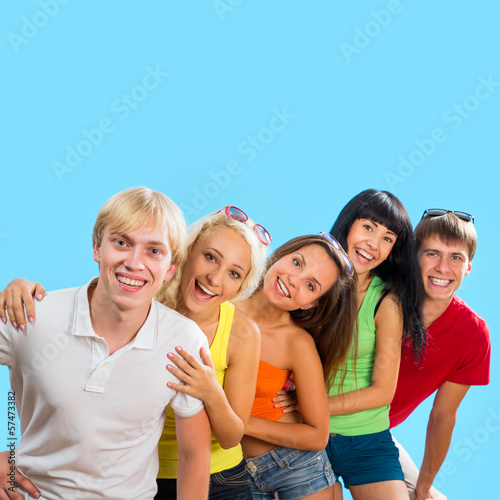 Happy teenagers on a blue background