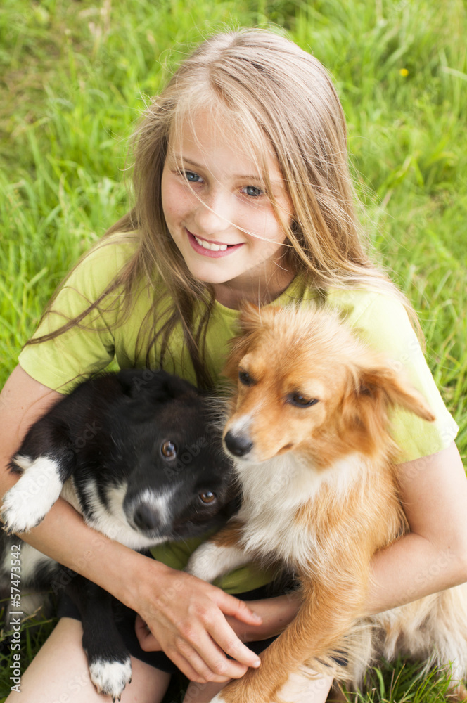 Happy child playing with dogs Happy child playing with dogs