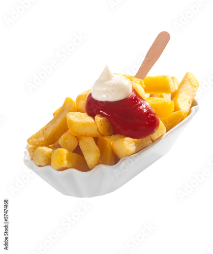 Dish of French fries  ketchup and mayonnaise