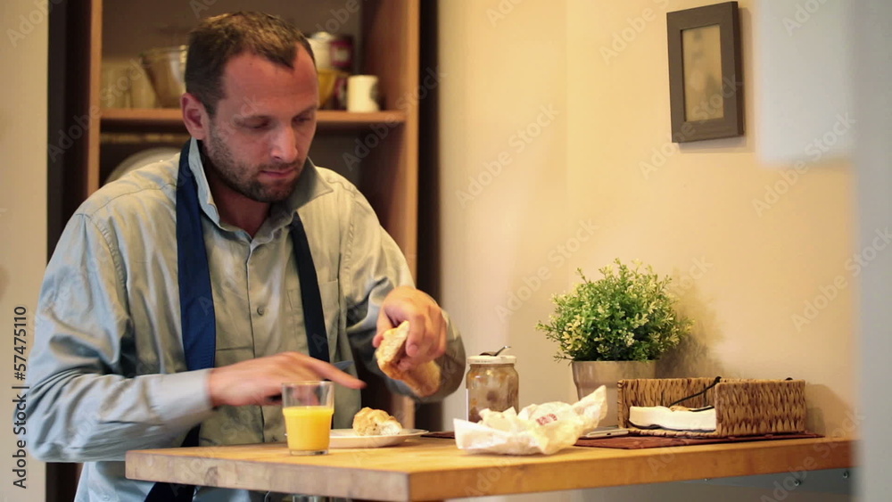 Businessman preparing breakfast in kitchen Businessman preparing breakfast in kitchen