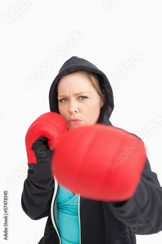 Concentrated woman boxing