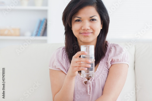 Woman holding a glass of water