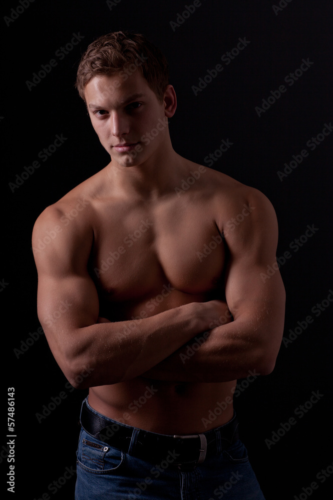 Muscle sexy naked young man posing in jeans Muscle sexy naked young man posing in jeans