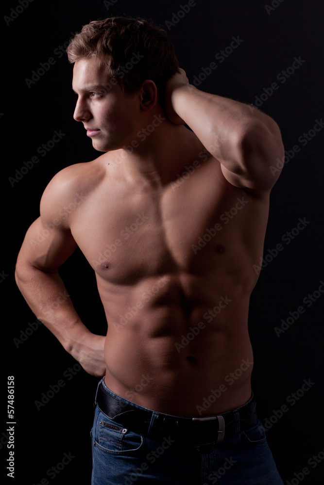 Fototapeta premium Muscle sexy naked young man posing in jeans