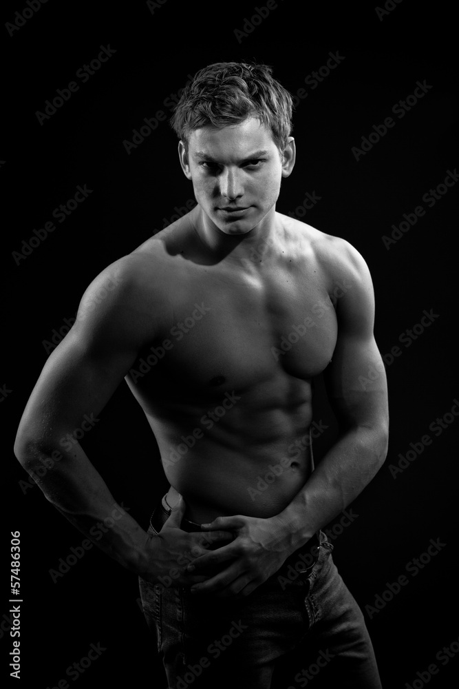 Muscle sexy naked young man posing in jeans Muscle sexy naked young man posing in jeans