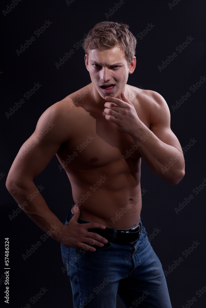 Fototapeta premium Muscle sexy naked young man posing in jeans