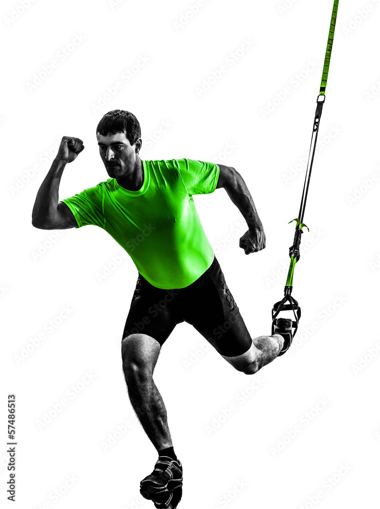 Fototapeta premium man exercising suspension training trx silhouette