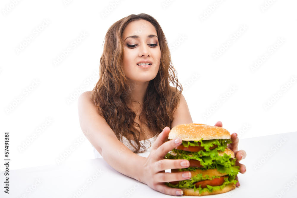 Happy Young Woman Eating big yummy Burger isolated Happy Young Woman Eating big yummy Burger isolated