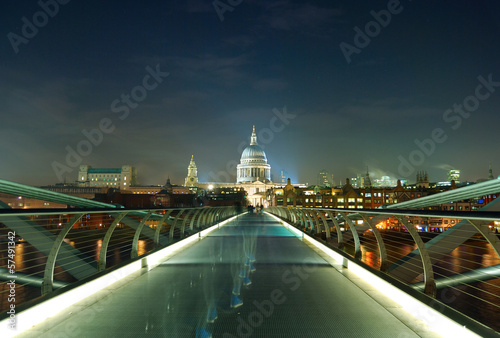 Night shot of the millennium bridge over the river Thames in Lon