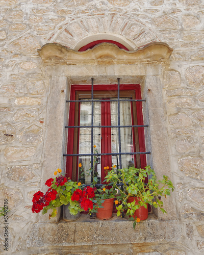 picturesque window and flowerpots, Greece
