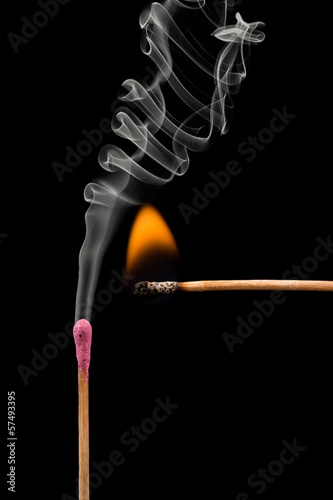whole and burnt matches with smoke