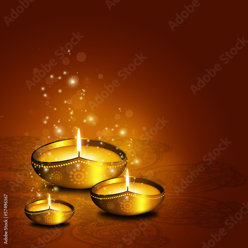 oil lamp with plac for diwali greetings over dark background