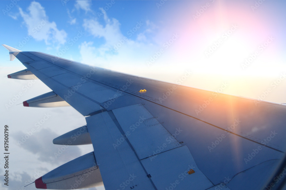 Wing of an airplane in the sunset Wing of an airplane in the sunset
