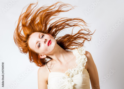 red haired expressive female with flying hair