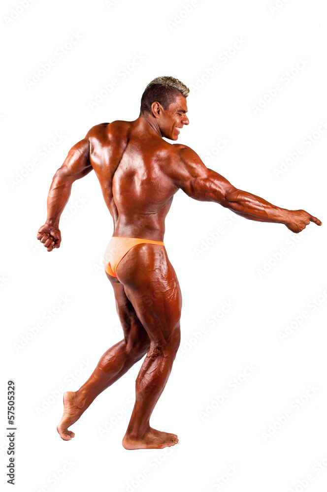 bodybuilder flexing his muscles in studio bodybuilder flexing his muscles in studio