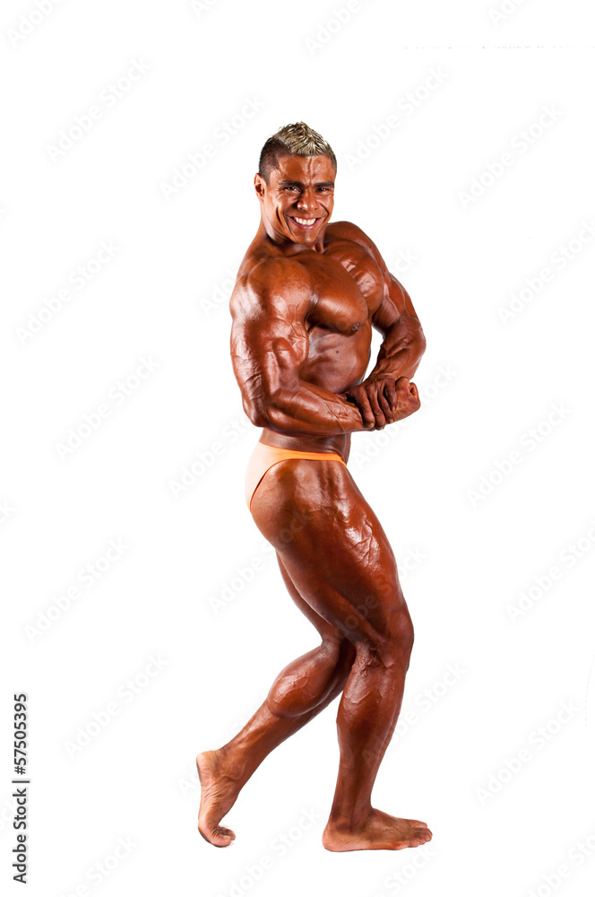bodybuilder flexing his muscles in studio bodybuilder flexing his muscles in studio
