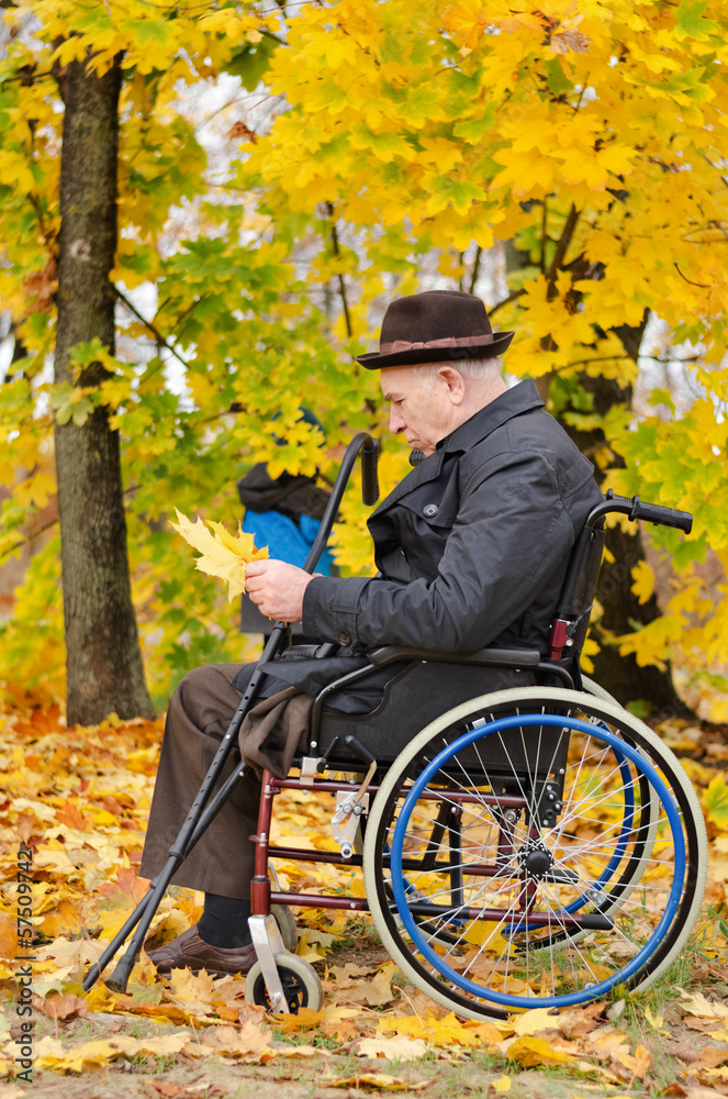 Disabled grandfather and grandchild outdoors Disabled grandfather and grandchild outdoors
