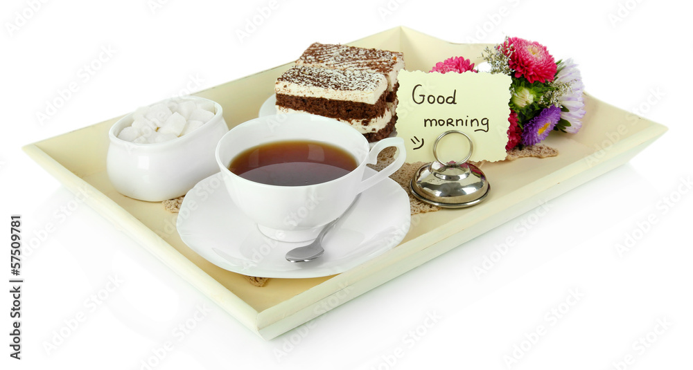 Cup of tea with cakes on wooden tray isolated on white