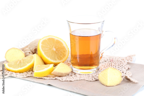 Cup of tea with ginger on napkin isolated on white