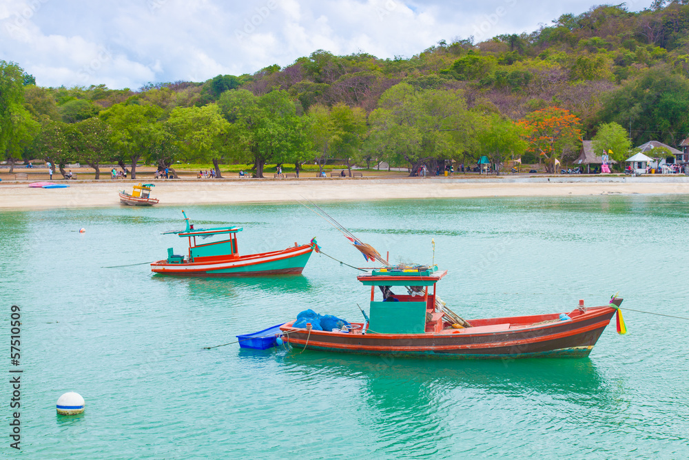 Small fishing boats moored in the sea.