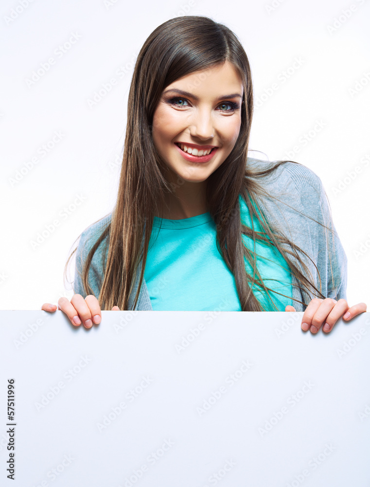 Teenager girl hold white blank paper. Young smiling woman show Teenager girl hold white blank paper. Young smiling woman show