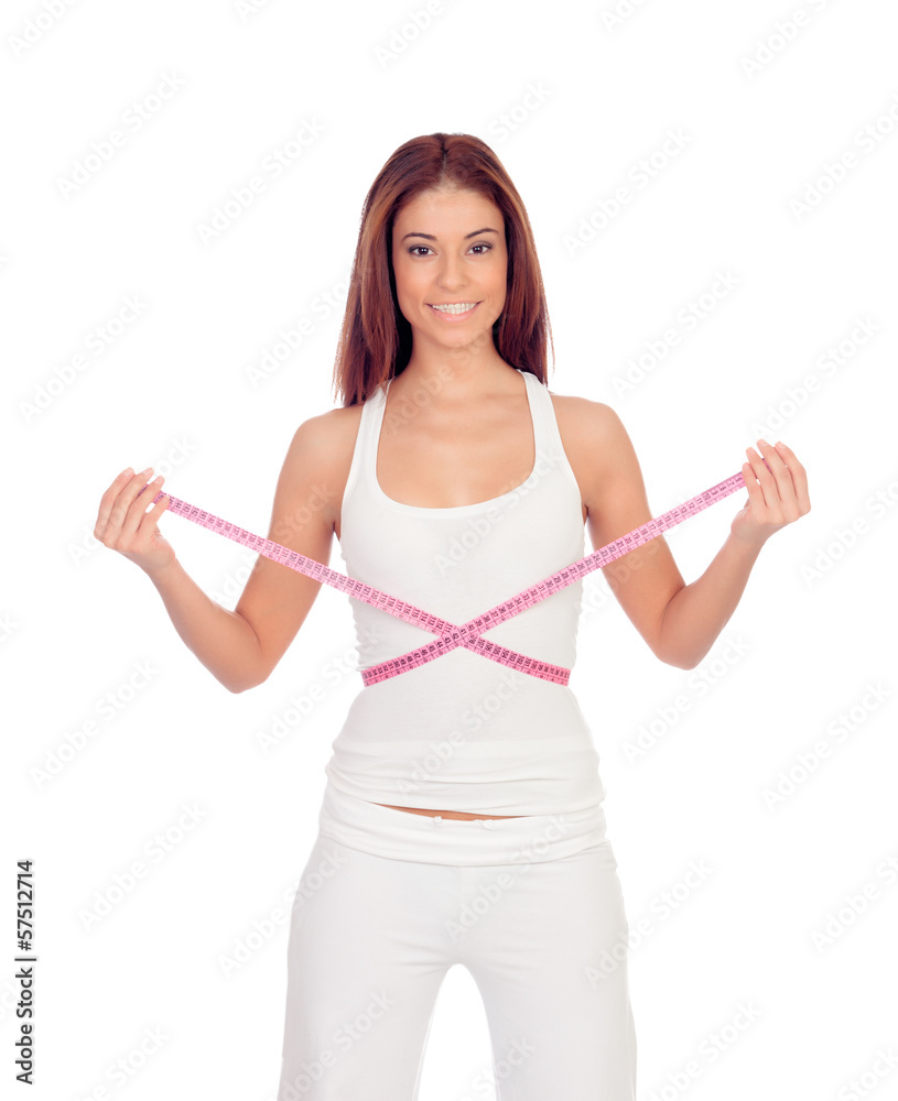 Attractive happy girl with a tape measure measuring her waist Attractive happy girl with a tape measure measuring her waist
