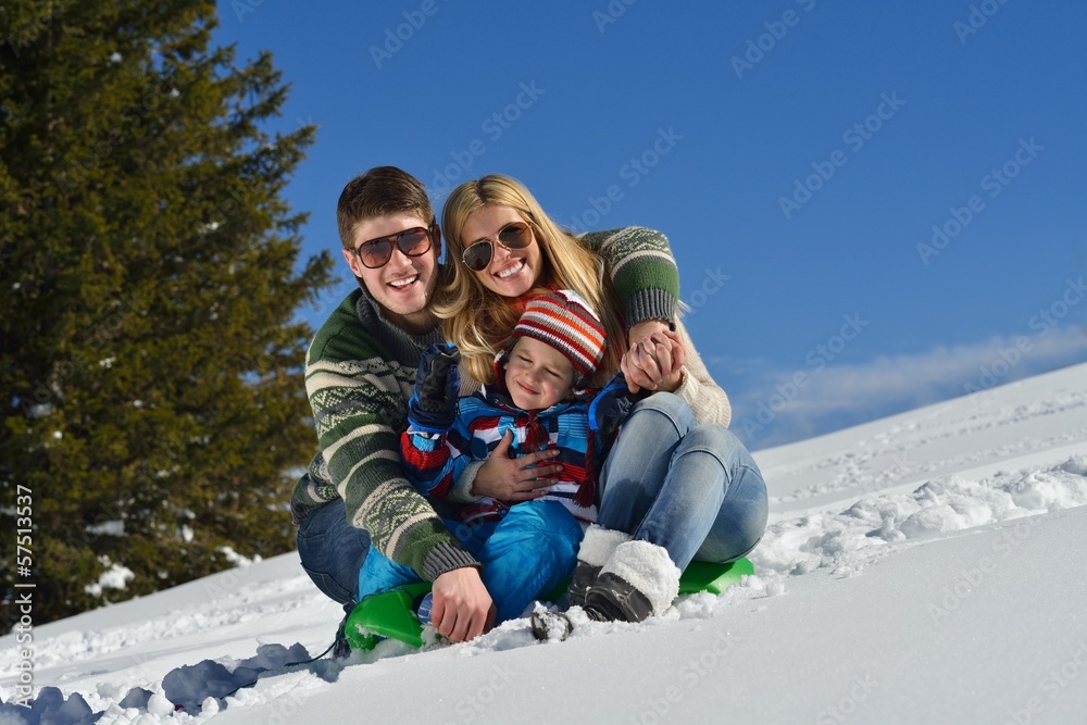 family having fun on fresh snow at winter family having fun on fresh snow at winter