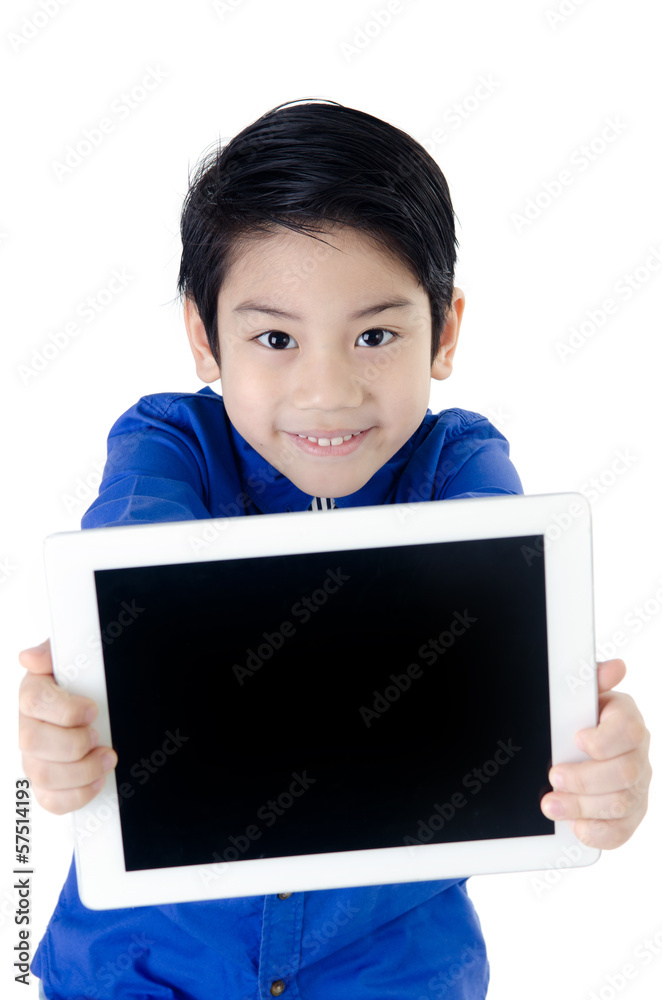 Little asian boy smiles with tablet computer on isolated backgro Little asian boy smiles with tablet computer on isolated backgro