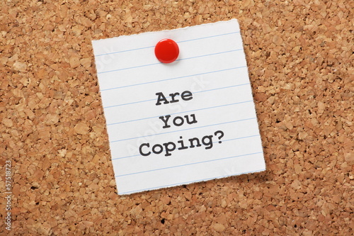Are You Coping? message on a cork notice board