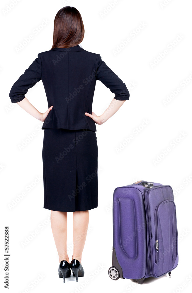 back view of thoughtful business woman traveling with suitcas. back view of thoughtful business woman traveling with suitcas.