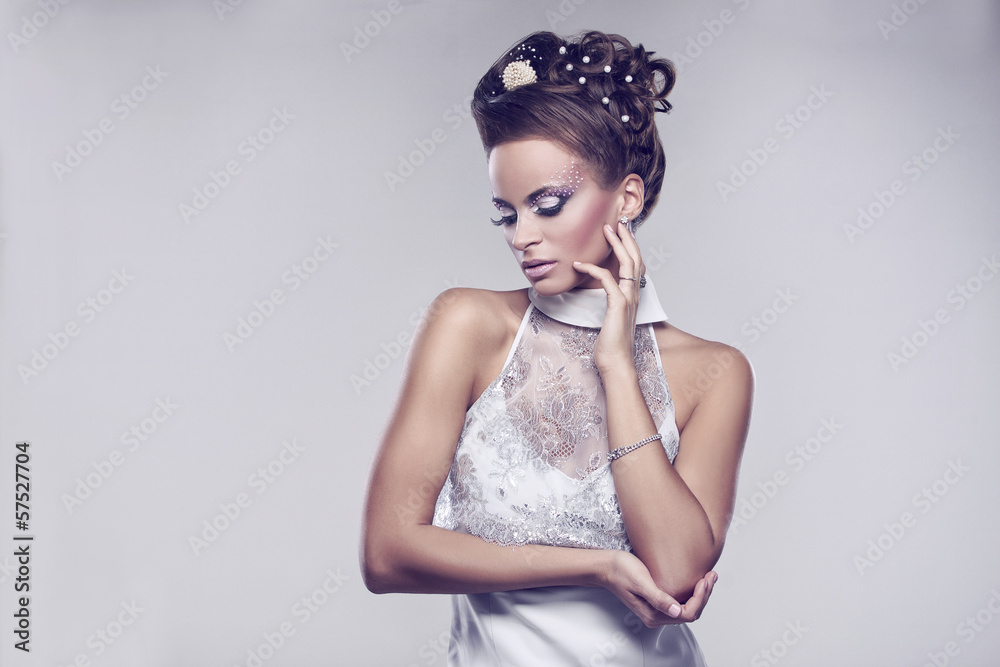 Young and beautiful bride standing in studio Young and beautiful bride standing in studio