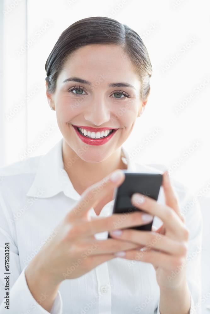 Smiling business woman with mobile phone Smiling business woman with mobile phone