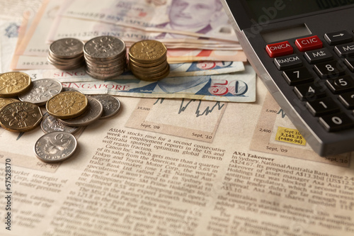 Newspaper stock market with calculator and money