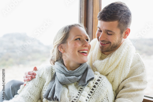 Cheerful young couple in winter clothing
