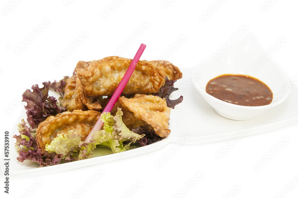 Japanese dumplings with lettuce on white background Japanese dumplings with lettuce on white background