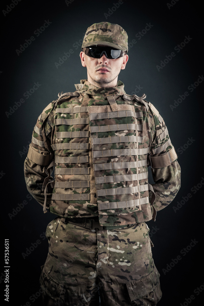 Military man on a black background