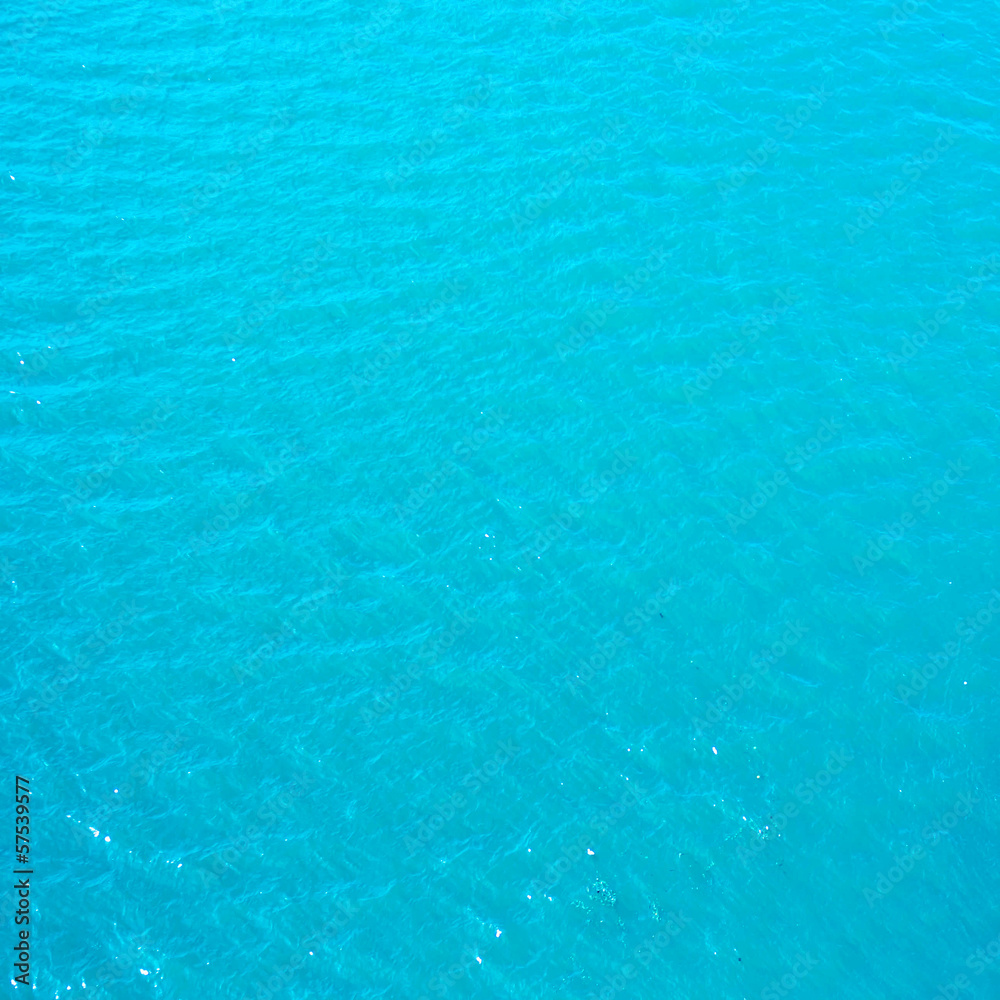 Bright cyan blue  sea water may use as background or texture.