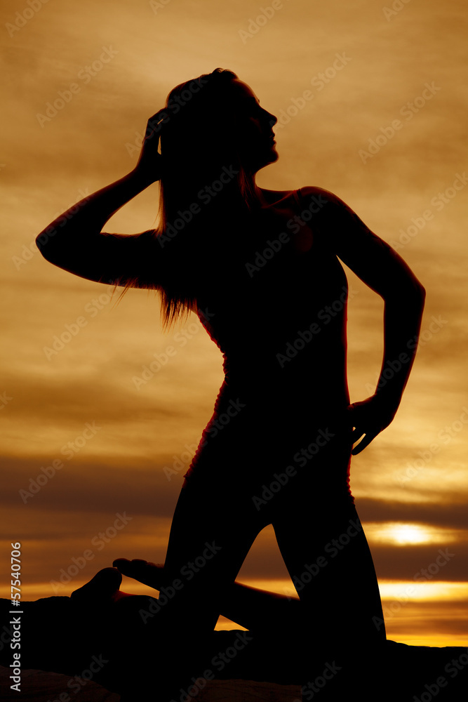 silhouette woman on knees look side