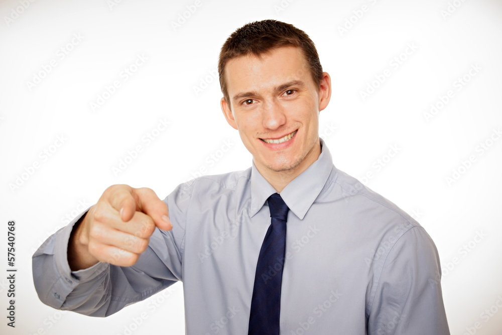 Young businessman at shirt and tie pointing at you. Young businessman at shirt and tie pointing at you.
