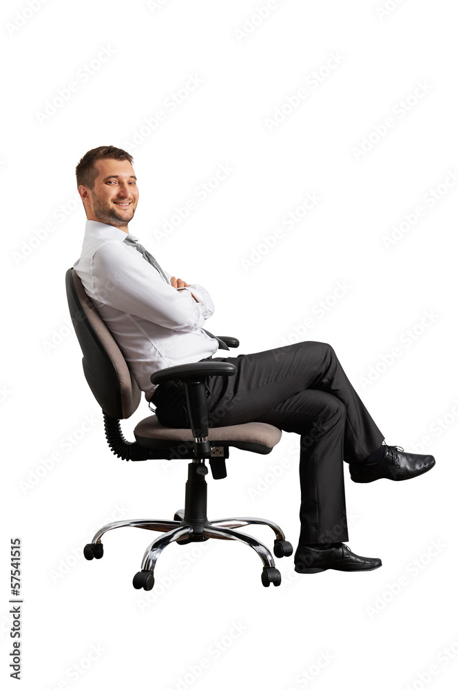 successful man sitting on the office chair successful man sitting on the office chair