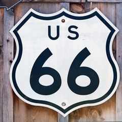 Acrylglasbilder Route 66 Big Route 66 sign on the fence of Arizona house  © Natalia Bratslavsky
