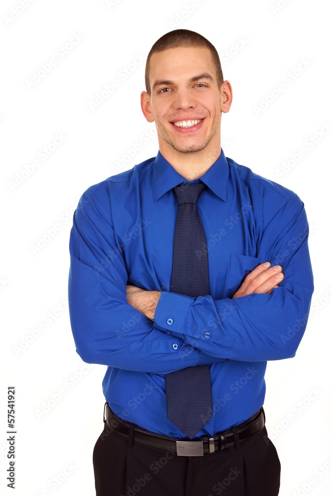 Young businessman at blue shirt and tie standing. Young businessman at blue shirt and tie standing.