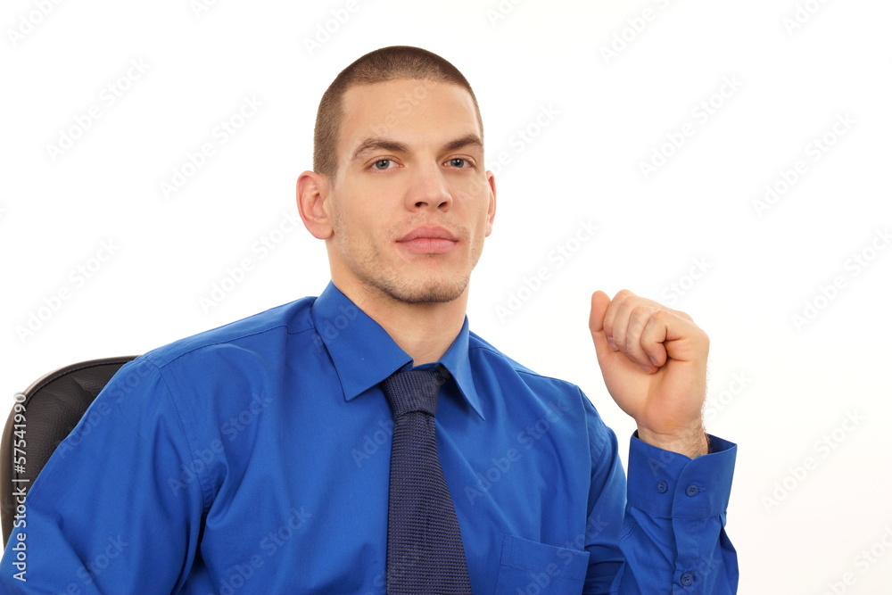 Young businessman at shirt sitting on a chair Young businessman at shirt sitting on a chair