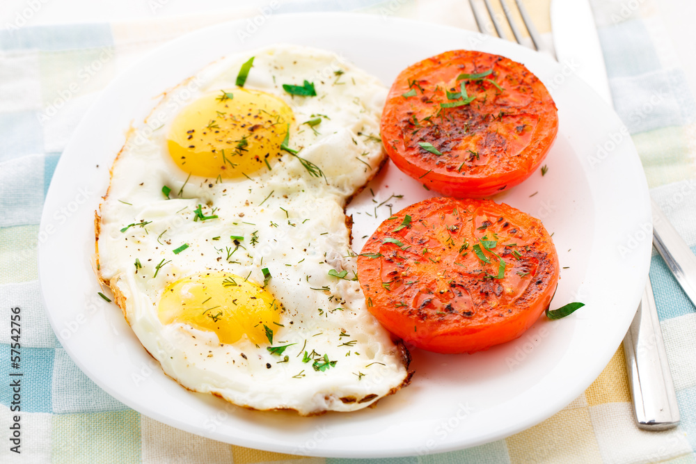 Breakfast with fried eggs and tomato Breakfast with fried eggs and tomato