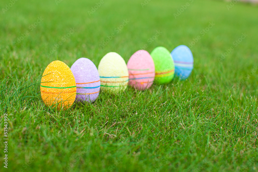 Colored colorful easter eggs in the grass