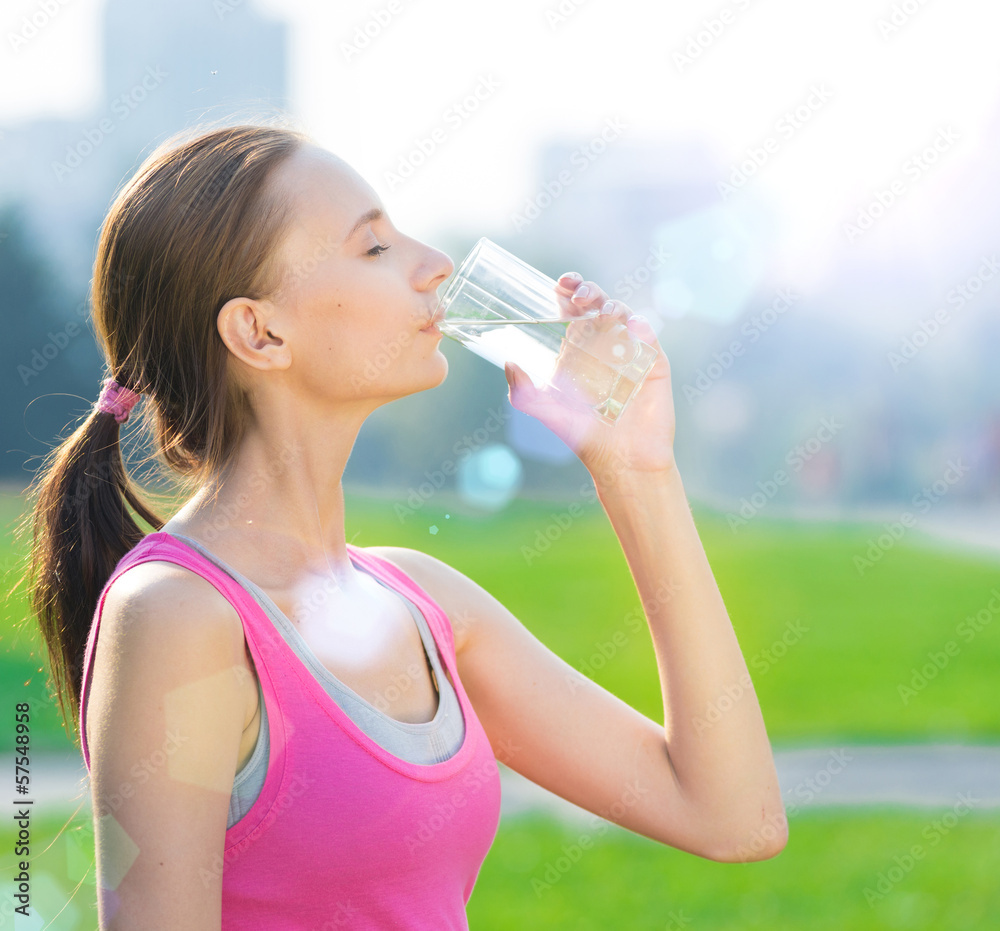 Portrait of woman drinking water after sport Portrait of woman drinking water after sport