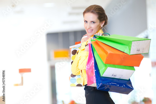 Shopping woman with color bags