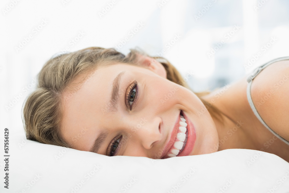 Obraz premium Content calm woman lying in her bed in the bedroom