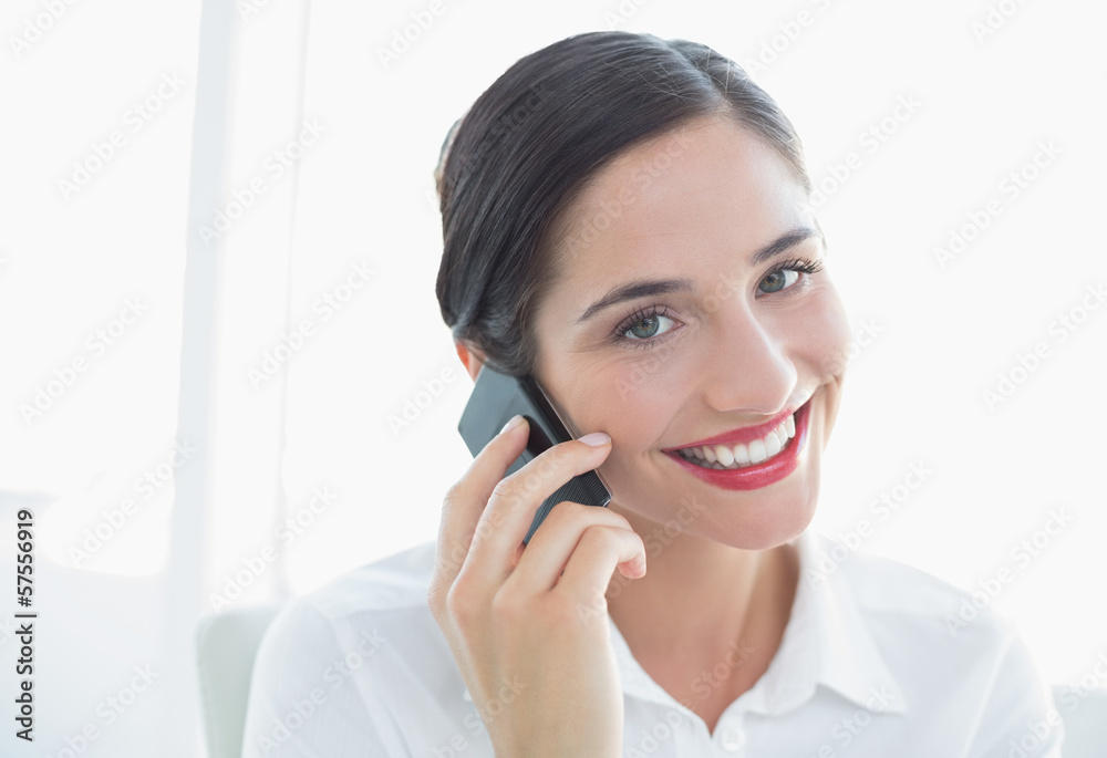 Smiling business woman using mobile phone Smiling business woman using mobile phone